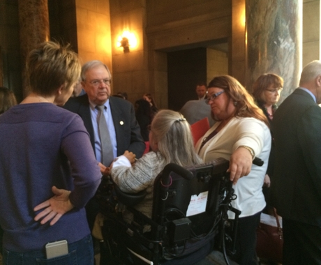 Folks talking with state senator at capitol