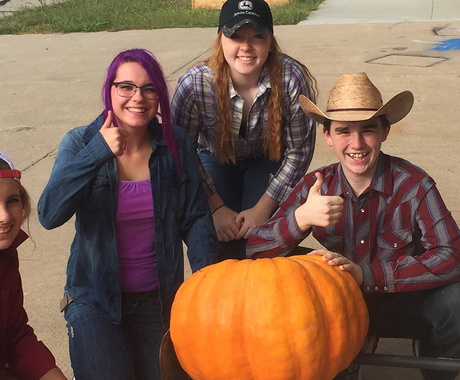 Students with giant pumpkin