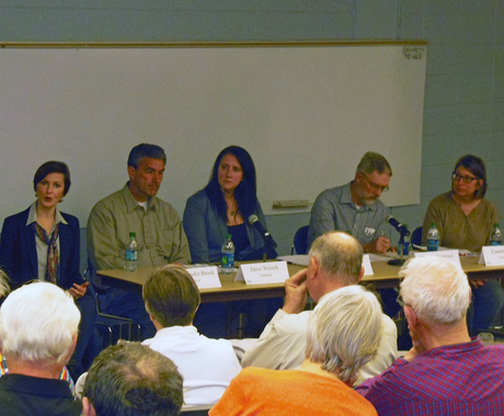 Panel of folks in front of an audience