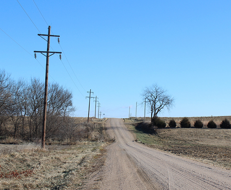 Power line along gravel road