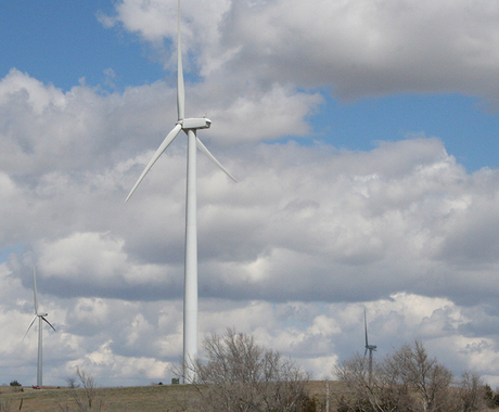 Wind turbine with fluffy clouds