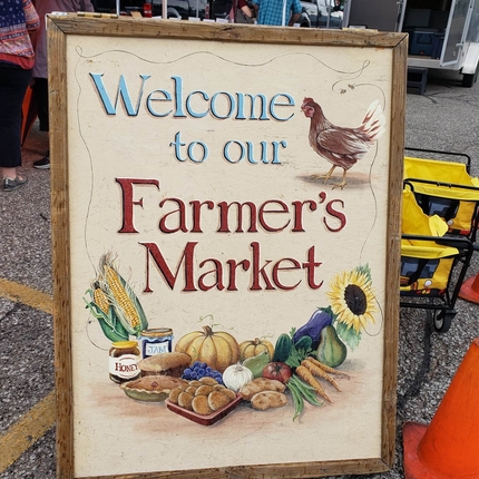 Sign that says "Welcome to Our Farmers Market"