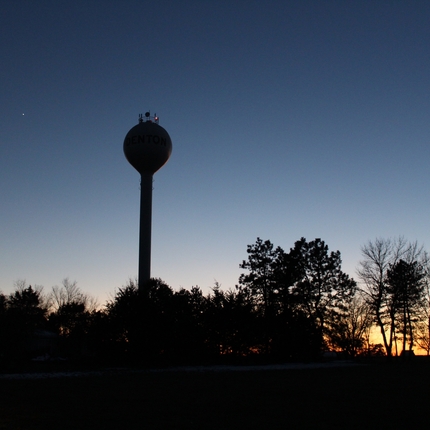 Rural town water tower at sunset