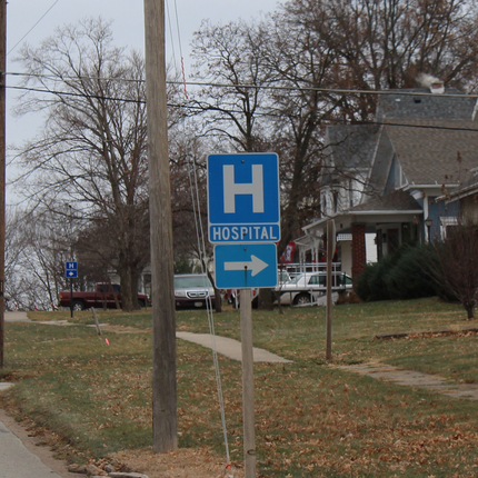 Sign pointing to hospital