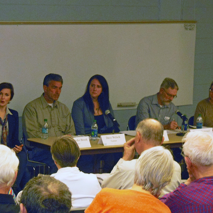 Panel of folks in front of an audience