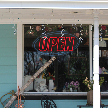 Front window of business with open sign