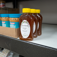 Honey stocked on shelves at a food pantry.