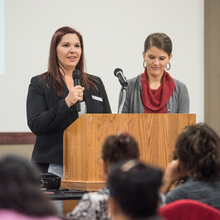 Two women speaking at conference