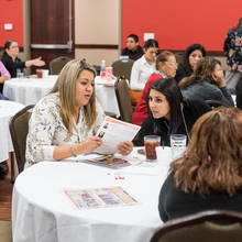 Two women networking at conference