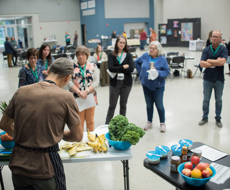 People watching a food demonstration