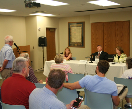 Someone asking questions to candidates 
