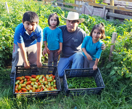 Justino Borja and children in garden