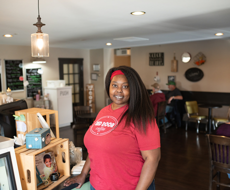 Woman stands in coffee shop