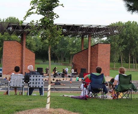 Folks in lawn chairs watching a concert