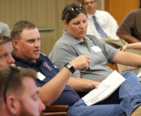 Man speaking in group at conference