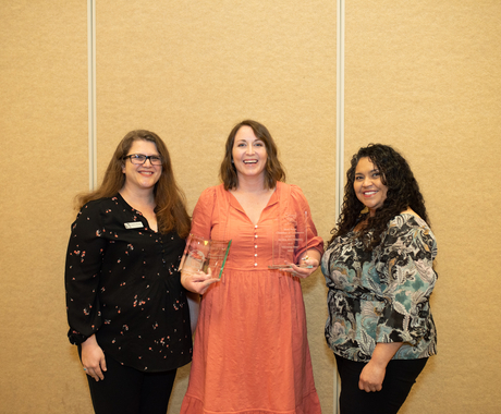 three women posing for photo