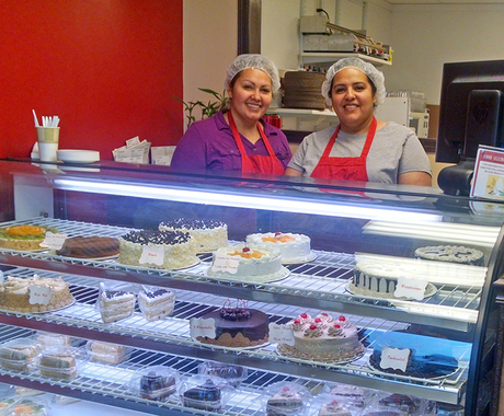 Bakery owners behind counter
