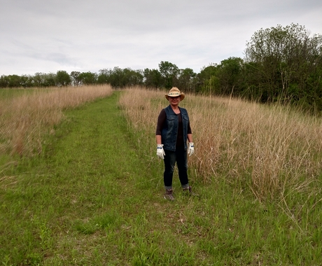 Ann Wolf standing in prairie