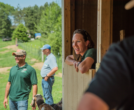 People in and around barn