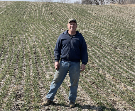 Bruce Willems standing in a field