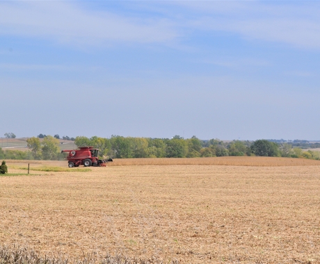 red combine in field