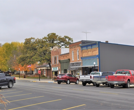 street with cars and businesses in background