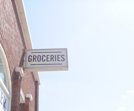 Groceries sign on the side of a building