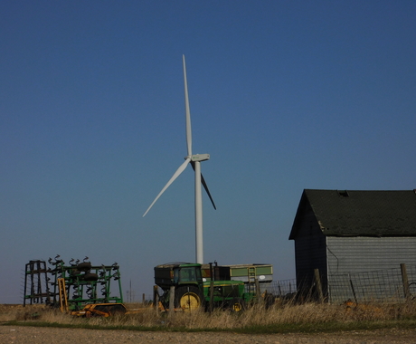Wind turbine by farming equipment 