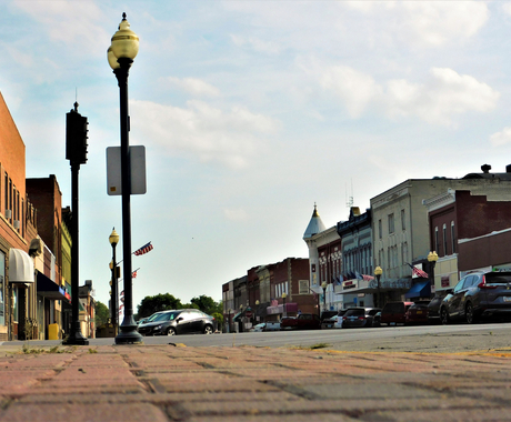 main street with cars and businesses