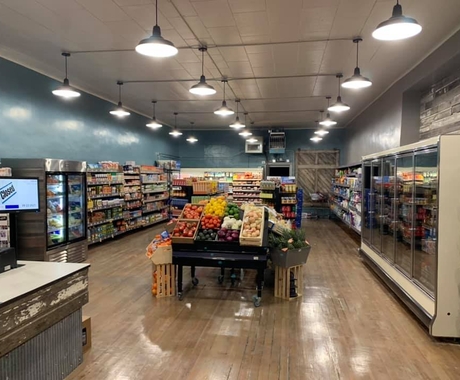 grocery store with produce and aisles of food