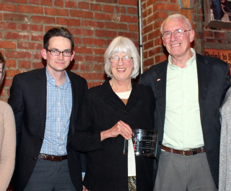 Three women and two men with award