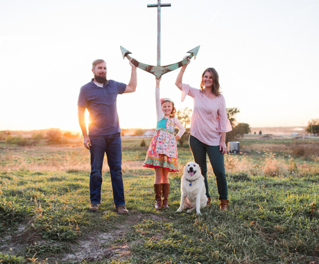 Family posing in field