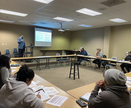 Man speaking to classroom of business owners