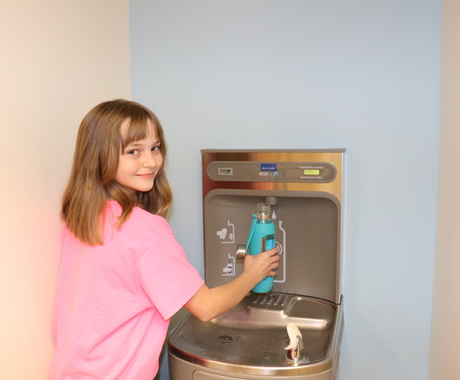 Student at water fountain