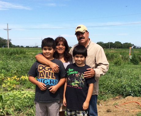 Latino family in field