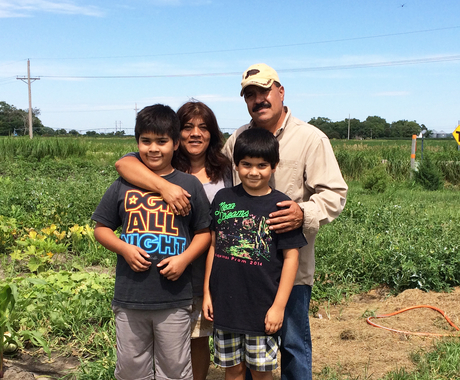 Latino family in field