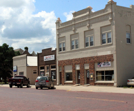 main street with buildings and cars on it