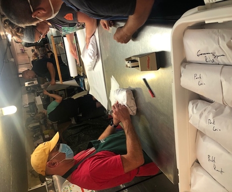 Man labeling packaged meat