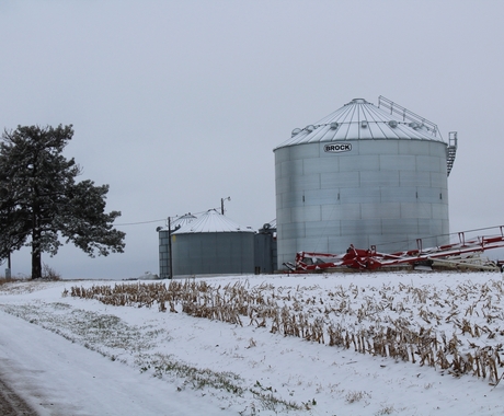 Grain bins with snow