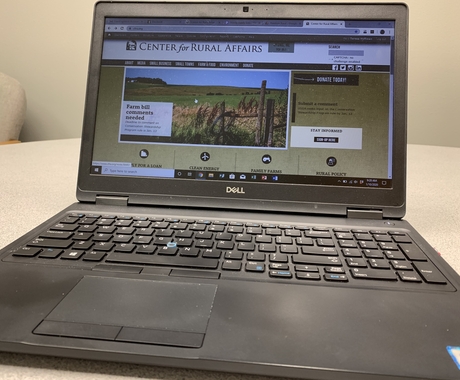 A laptop screen showing the Center's website