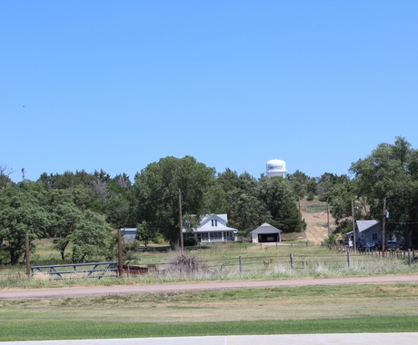 Rural community water tower and farm place