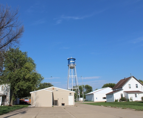 Houses with a water tower in the background.