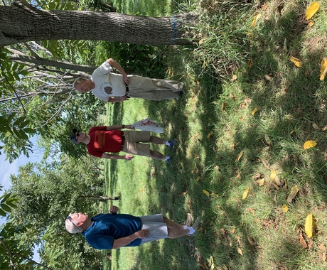 Three men at a fruit and nut farm