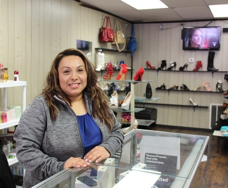 Woman business owner behind counter