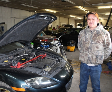 Latino business owner at auto shop