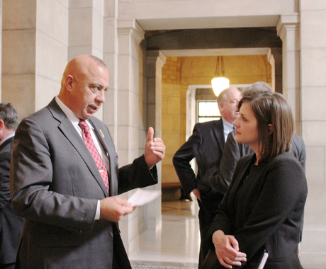 State senator and Center for Rural Affairs staff member talking