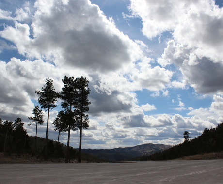 Hills and trees with clouds