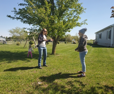 two women outside talking