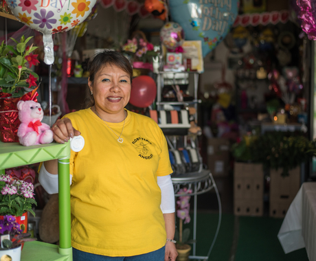 Business owner standing her in her florist shop
