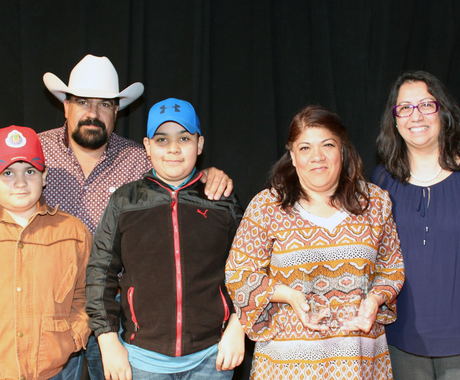 Two boys, a man, and two woman at award presentation